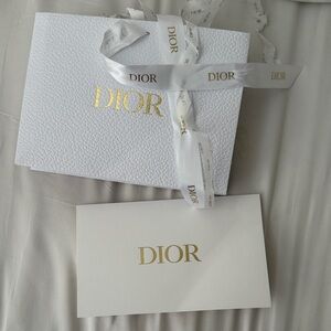 Dior white and gold gift bag for beauty with confetti and receipt holder